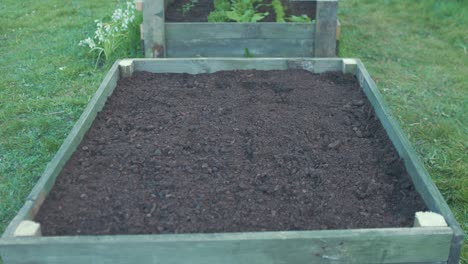 Finished-raised-garden-bed-with-compost-soil-ready-for-planting