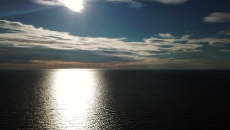 Drone-view-of-a-bright-sunlight-over-the-water