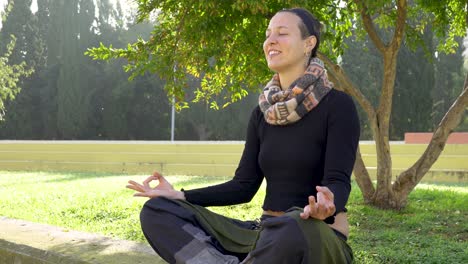 Yoga-teacher-smiling-and-doing-lotus