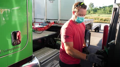 Trucker-Fuels-Truck-during-Pandemic,-Covid,-Coronavirus
