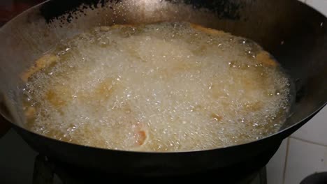 Close-up-Footage-of-Deep-Fried-Shrimp-in-Boiling-Oil