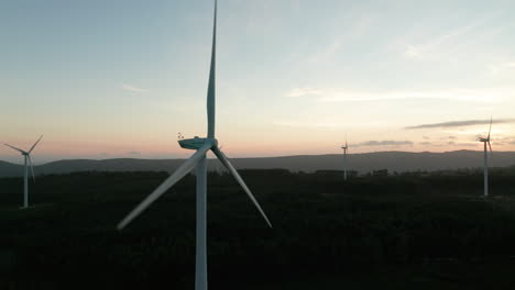 Wind-Turbines-Slowly-Turning-During-Colorful-Sunset-At-Nature-Landscape-In-Serra-de-Aire-e-Candeeiros,-Leiria,-Portugal