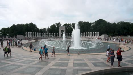 Tourist-Sightseeing-And-Pass-By-The-Famous-Fountain-At-World-War-II-Memorial-In-Washington-DC