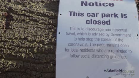 Car-park-closed-sign-due-to-coronavirus-panning-shot