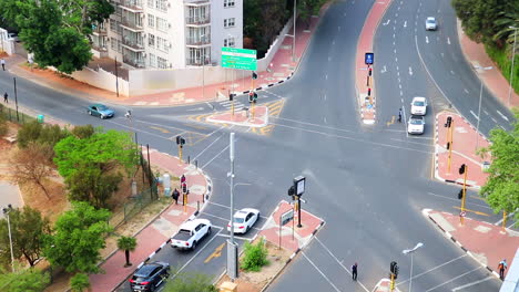 time-lapse-aerial-shot-of-traffic-moving-through-an-intersection-in-Santon-South-Africa