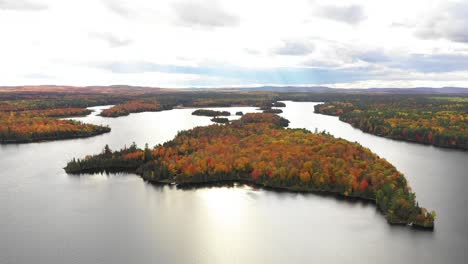 island-on-lake-with-beautiful-fall-colored-trees