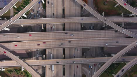 Birds-eye-drone-view-of-traffic-on-I-10-West-and-Beltway-8-freeway-in-Houston,-Texas
