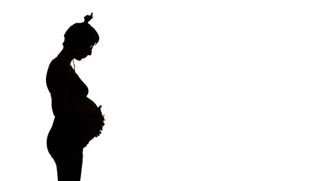 Linke-Silhouette,-Eine-Hochschwangere-Frau-Schaut-Nach-Unten-Und-Streichelt-Ihren-Bauch
