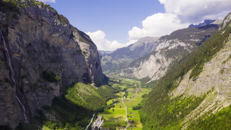 Aerial-Hyperlapse-over-green-valley-between-beautiful-mountains