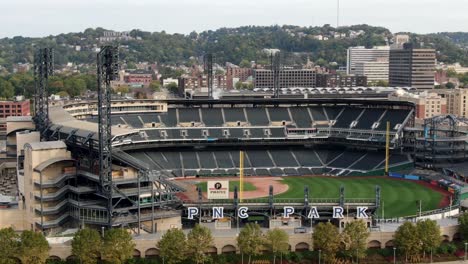 PNC-Park,-home-of-Pittsburgh-Pirates,-parallax-aerial-shot-reveals-stadium-and-baseball-diamond-of-World-Series-MLB-baseball-team