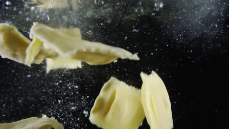 ravioli-falling-into-a-bowl-full-of-water-in-slow-motion