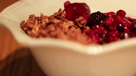 A-Healthy-Bowl-Of-Fruit-Berries-And-Cereals---Slow-Motion-Pan-Right
