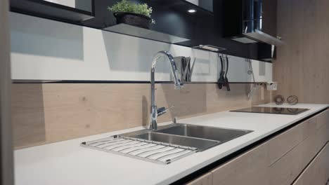 A-wood-kitchen-showroom-gimbal-shot-bench-and-faucet