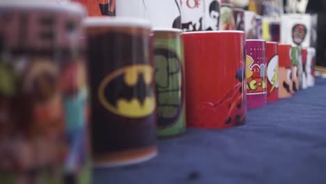 Close-up-gimbal-shot-of-coffee-mugs-for-sale-at-street-market