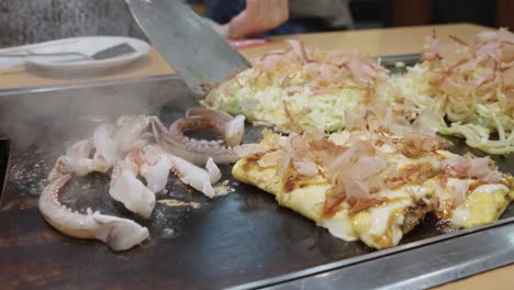 Yakisoba-and-Squid-being-grilled,-slow-motion-shot