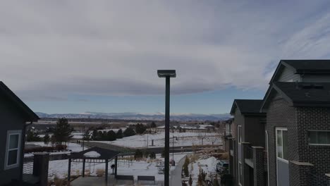 A-suburban-neighborhood-with-a-rocky-mountain-view-during-winter-2021