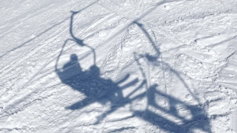 Traveling-about-the-shadow-of-two-skiers-on-the-lift-in-Baqueira-Beret---Pyrenees