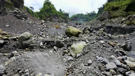 Large-rocks-and-volcanic-sand-in-quarry-in-Magelang,-Indonesia,-aerial-view