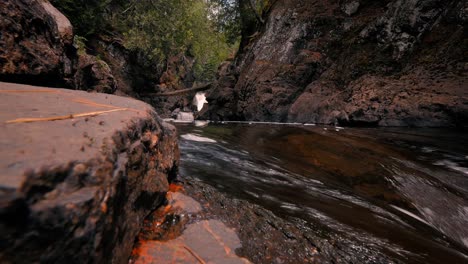 Cascading-river-flowing-through-rocky-gorge-in-the-woods-at-Cascade-River-State-Park-in-Minnesota