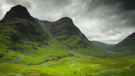 TIME-LAPSE---The-Three-Sisters-of-Glen-Coe,-Scottish-Highlands,-wide-pan-left