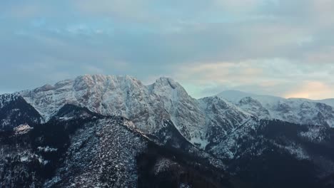 Panorama-Of-Snowy-Tatra-Mountain-Range-With-Forest-During-Winter-In-Europe