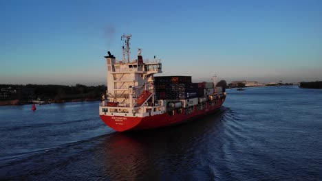 Rear-View-Of-A2B-COMFORT-Container-Ship-With-Intermodal-Containers-Travelling-At-Oude-Maas-River-In-Netherlands
