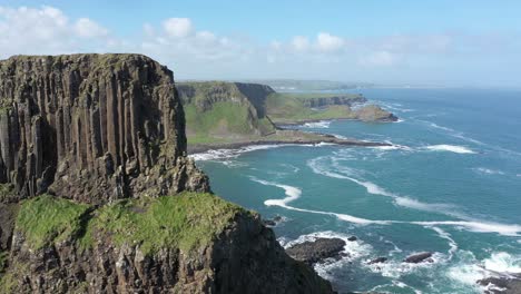 The-Giants-Causeway-lies-at-the-foot-of-the-basalt-cliffs-along-the-sea-coast-on-the-north-shores-of-County-Antrim