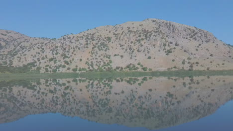 Aerial-view-of-a-mountain-reflection-in-the-water