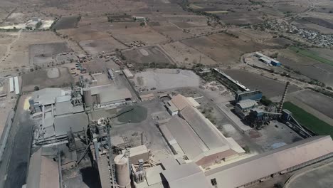 Cement-manufacturing-plant-during-under-construction,-Aerial
