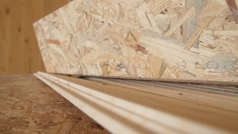 Travelling-of-some-OSB-in-detail-of-a-carpentry-work-in-a-new-building-site-all-made-of-wood