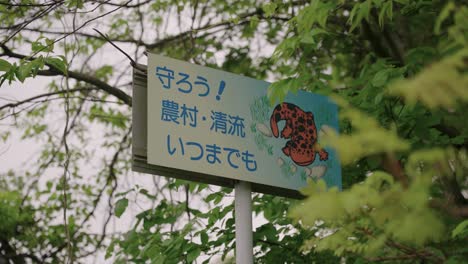 Japanese-road-sign-reading-"Protect-the-rural-area-and-rivers-forever"