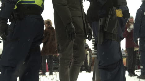 Close-up-waste-down-shot-of-a-police-officer-carrying-a-Taser,-during-protests-in-Helsinki