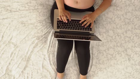 cenital-view-of-a-young-woman-working-on-laptop