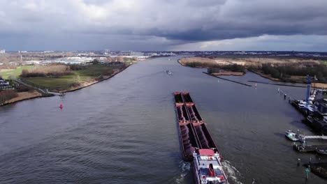 Bulk-Carrier-With-Multiple-Cargo-Hold-Loaded-With-Coal-And-Ore-Sailing-On-Oude-Maas-River-Near-Puttershoek-In-Netherlands