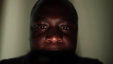 African-American-man-looking-at-phone-screen.-TECHCUP5BRIEF