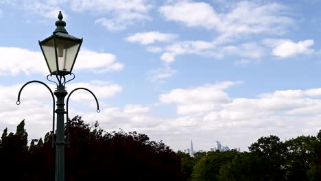 Time-Lapse-of-an-Old-Street-Lamp-at-Horniman-Museum-and-Garden-in-London-with-Clouds-Across-the-Blue-Skies