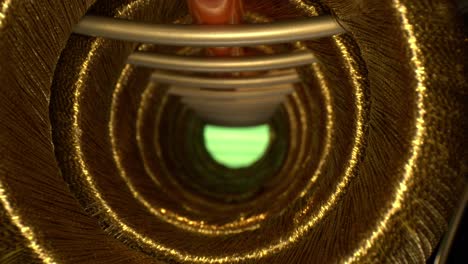 RACK-FOCUSING-a-series-of-threaded-golden-rings-forming-a-tunnel-that-is-green-at-the-end