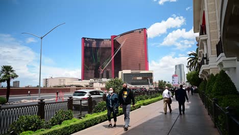 Tourist-groups-walking-on-the-Las-Vegas-Strip-across-from-Resorts-World