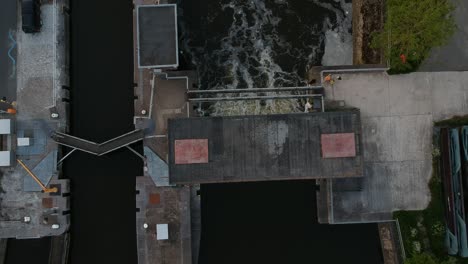 Water-flooding-out-of-water-lock-in-top-down-aerial-view