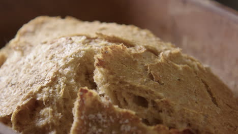 BAKING---Sourdough-bread-fresh-from-the-oven,-slow-motion-close-up