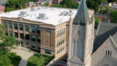 Aerial-view-of-Credit-Bureau-Lancaster-County-building-tower-revealing-Robert-Fulton-elementary-school,-Lancaster,-Pennsylvania,-USA