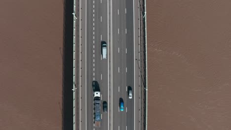 Top-down-drone-shot-of-busy-motorway-highway-bridge