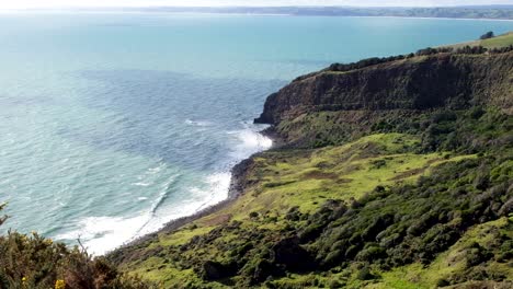 Rugged-terrain-landscape-of-Te-Toto-Gorge-near-Raglan,-cliffs,-coastal-and-ocean-waves,-on-a-walk-in-the-wilderness,-New-Zealand-Aotearoa