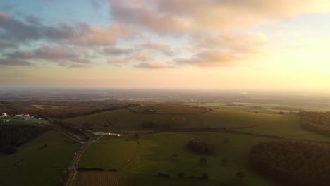 Aerial-shot-over-the-South-Downs-Way-walking-trail-in-England-at-sunset