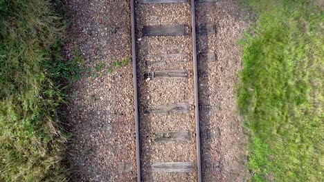 Railroad-zoom-out-effect-with-drone-shot-from-above