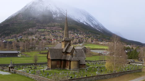 Old-Wooden-Church-in-the-Norwegian-Town-Lom---aerial-drone-shot