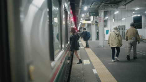 Young-Japanese-Girl-In-School-Uniform-Wearing-Mask-Getting-On-The-Train-In-Sendai,-Japan