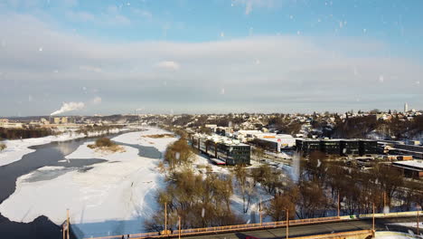 Kauno-Dokas-office-building-and-Vileisis-bridge-during-snowfall