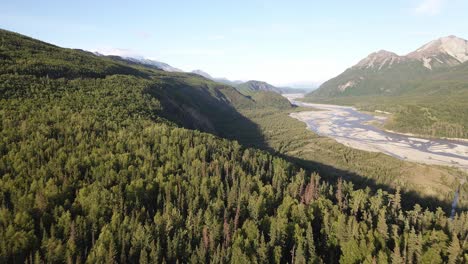 Aerial-flight-away-from-sunset-along-the-tree-tops-and-towards-the-Matanuska-River-in-the-Talkeetna-Mountains