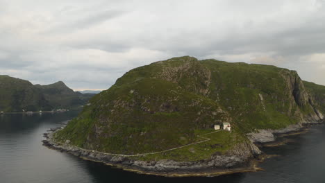 Aerial-View-Of-Road-On-Rugged-Mountain-Leading-To-Hendanes-Lighthouse-In-The-Town-Of-Maloy,-Near-The-Island-Of-Vagsoy-In-Norway